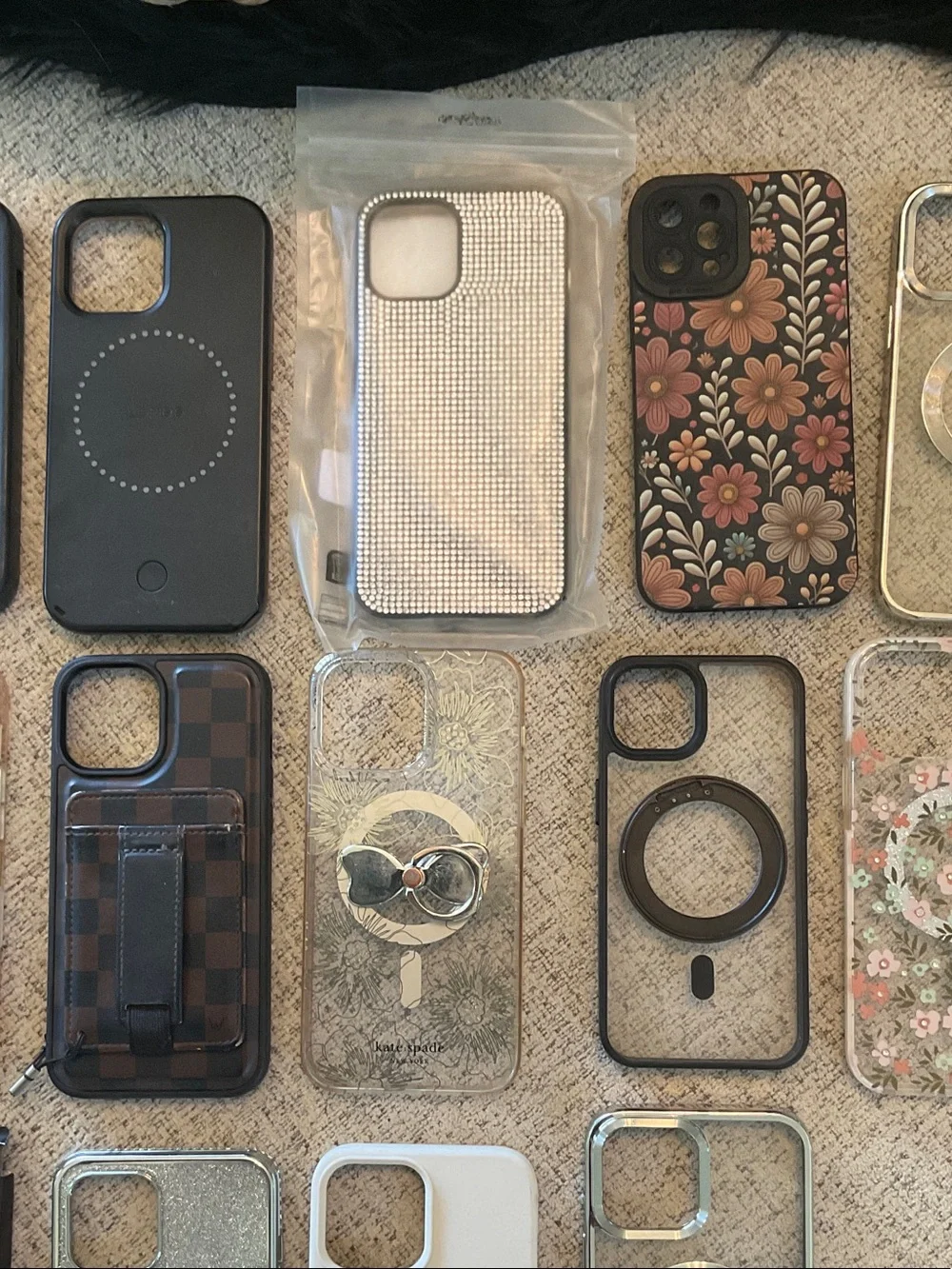 Assorted IPhone 12 Pro Max Phone cases and Screen Protectors